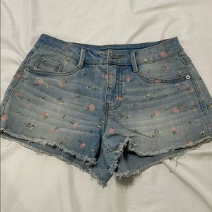Denim Shorts with flower details.